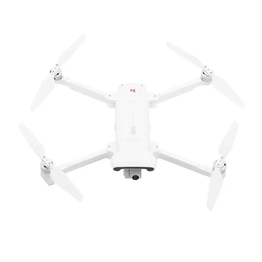 Installation facile des hélices silencieuses FIMI X8SE sur le drone, avec système de verrouillage.
