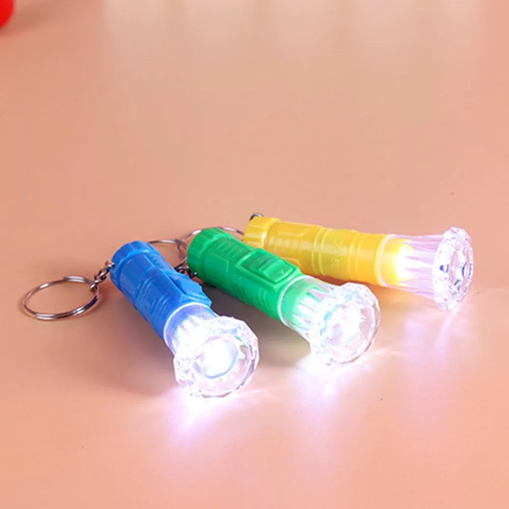 1PC Mini Plastic Hand Torch Portable Keyring Super Bright LED Flashlight Button Cell Powered Flash Light (Random Color)