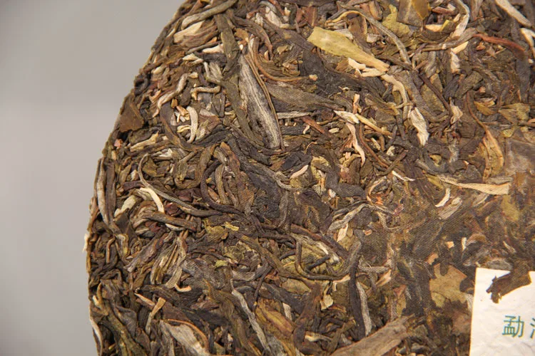 Menghai Ранняя весна сырой Pu-erh Nannuo горный Qizi чай торт 357 г Shen Pu'er чай