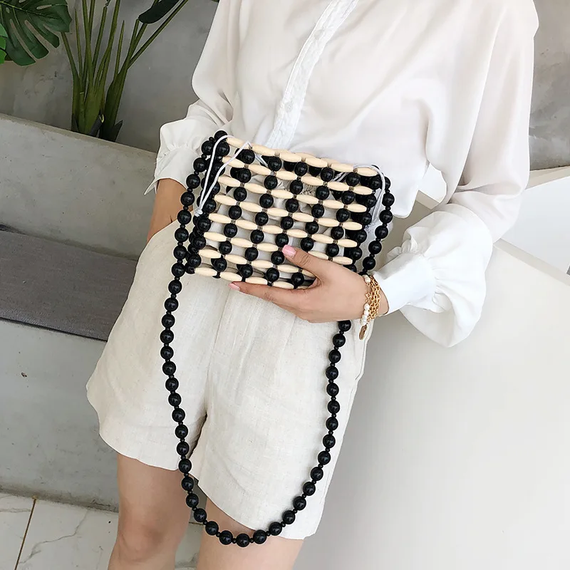 

2019 Buddhist black wood beads new summer hit color wooden single shoulder braided beads single shoulder slanted bag
