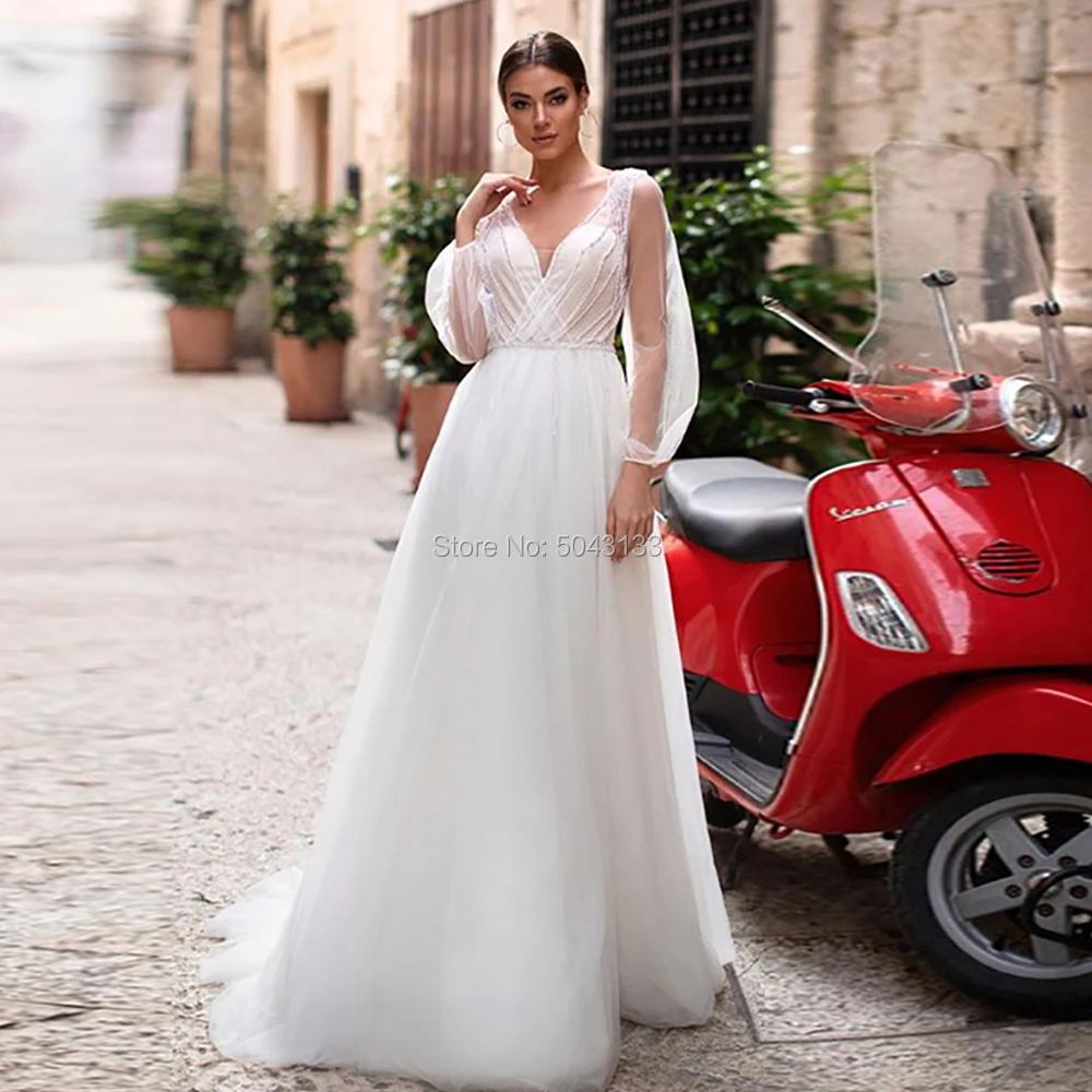 

Fascinating A Line Tulle Wedding Dresses 2019 Sexy V Neck Long Sleeves Boho Wedding Gowns Beaded Floor Length Beach Bride Dress