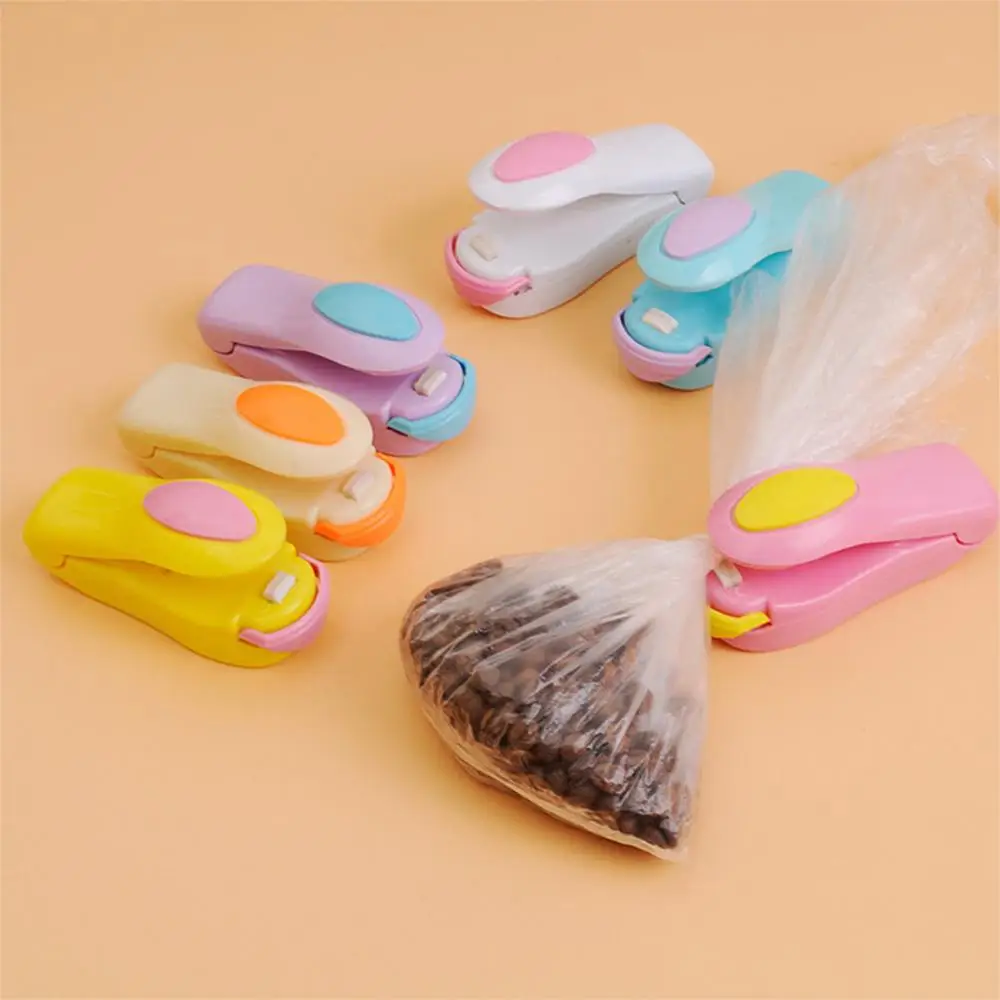 

Random Color Portable Mini Sealer Sealing Machine for Plastic Bags Sealing Food Preservation Storage Hand Press Bag Sealer Pack