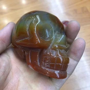 

1pcs Natural Crystal SKULL decoration Stones and Minerals Red agate through the carved by hand