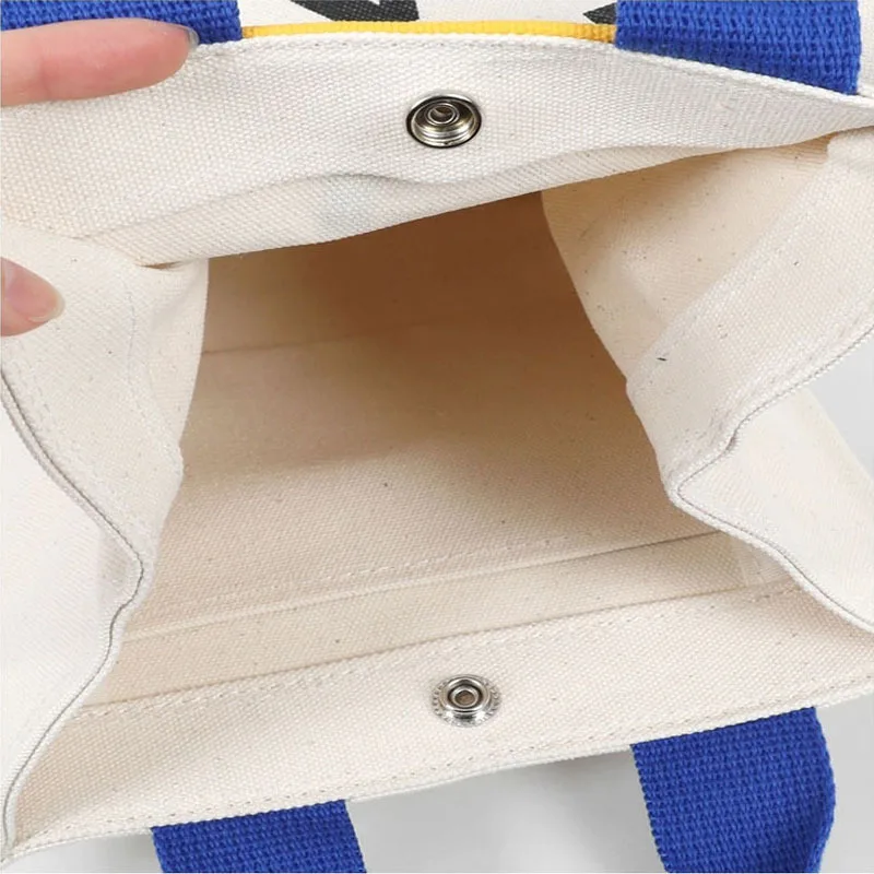 2022 Canvas bag New Summer Korean Japanese Cartoon Canvas Smile Handbag Large Capacity Shoulder Bag Hit Color Letter Female Tote