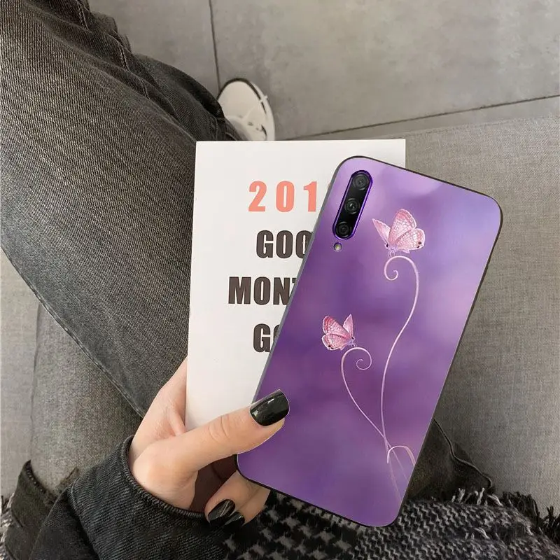 Red butterfly on white roses flower