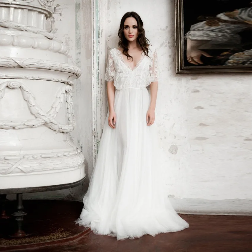 Vintage Vestido De Noiva 2016 Romantische Boho Goedkope Trouwjurken Sheer Lace V-hals Modieuze Sexy Bruidsjurken Half Mouw Vintage Vestido De Noiva 2016 Romantische Boho Goedkope Trouwjurken Sheer Lace V-hals Modieuze Sexy Bruidsjurken Half Mouw