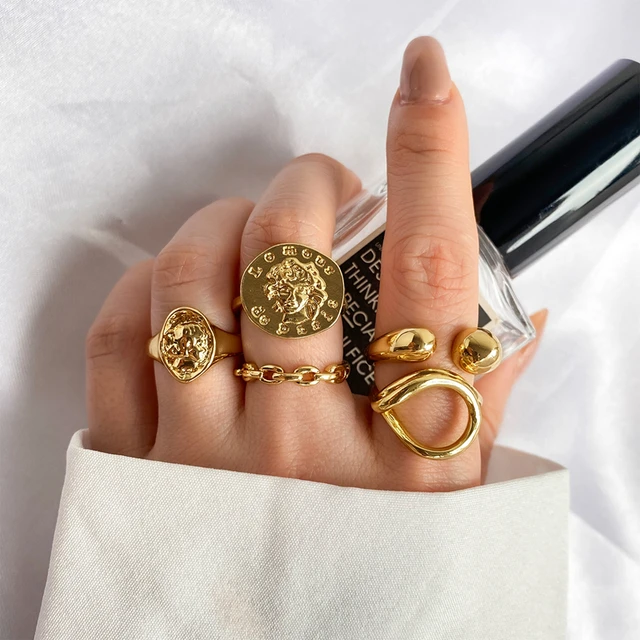 A regular gold coin ring is ornamented with diamonds. Its fine  craftsmanship and the art of fine jewellery a… | Gold coin ring, Gold coin  jewelry, Gold ring designs