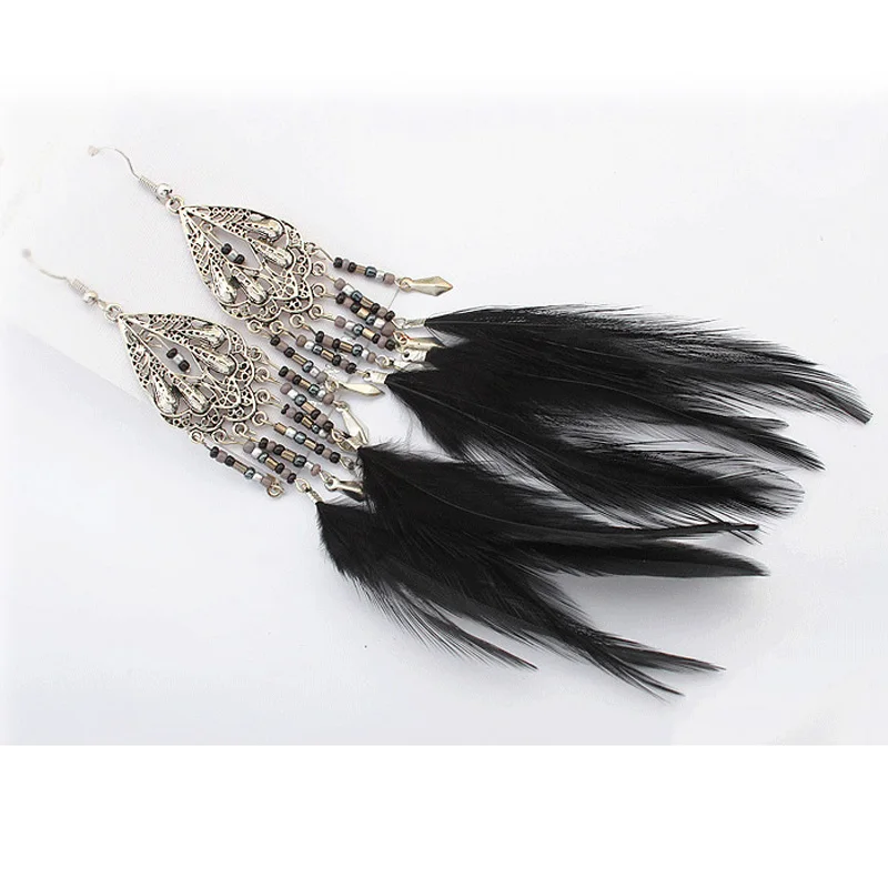 

Euro-American fashion retro exaggeration Bohemian style hollow-out water drop rice Bead Earrings national style feather tassels