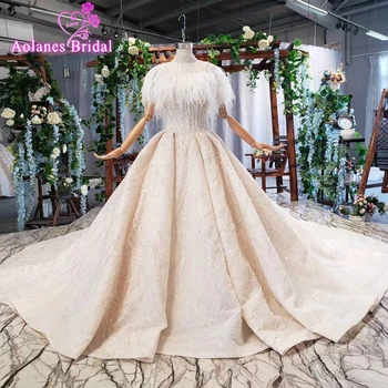 شراءفساتين زفاف فاخرة من الدانتيل العربي دبي 2019 مع الريش كيب تصميم خاص العنق الكرة ثوب الأميرة زي العرائس