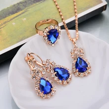Women's Beautifully Jewelry Set With Shimmering Rhinestones Surrounded By Blue Jewels Design Pendant Necklace/Earrings/Rings