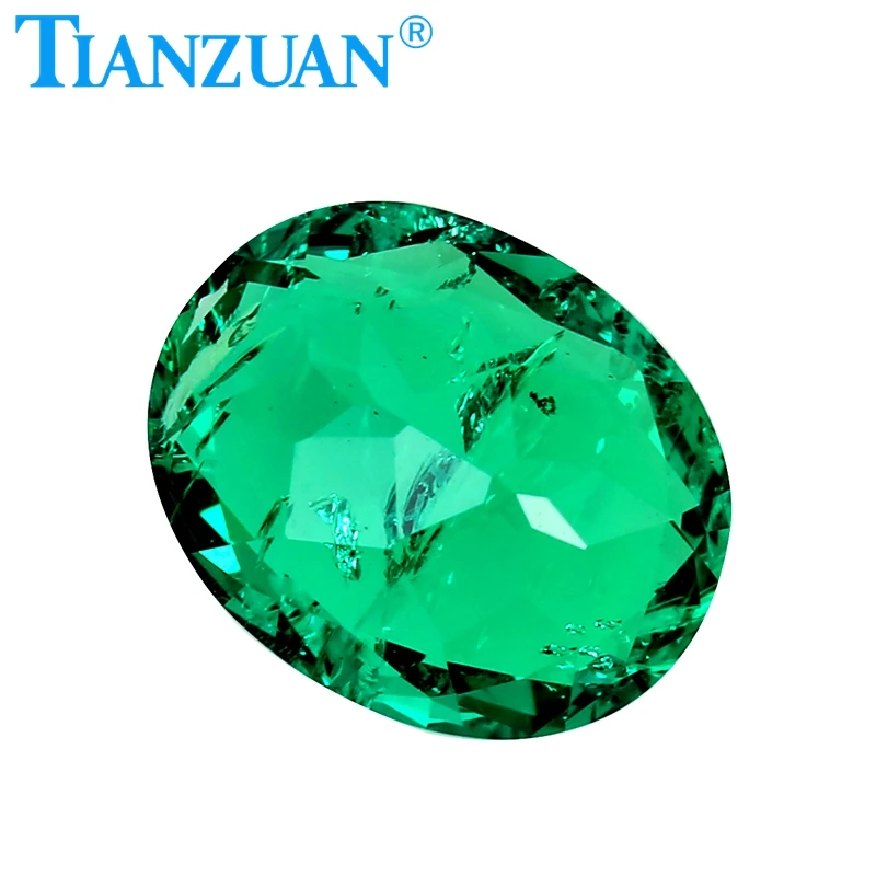 oval shape  Created Hydrothermal Columbia Emerald with minor cracks and inclusions inside of it loose gemstone
