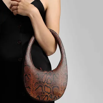 

Spring 2020 new minority design oval goose egg hand bag lady snakeskin pattern three-dimensional simple personality handbag
