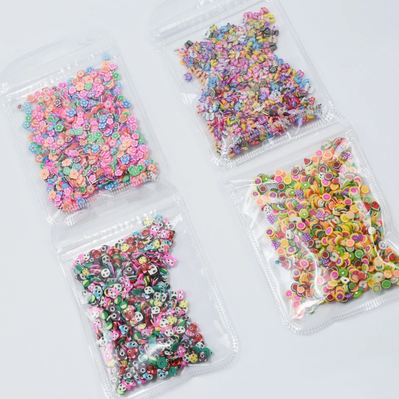 

1 Bag-(1000pc) Nail Art Polymer Clay Fimo Slice Flower/Kiwi/Heart-shape..Design Polymer Clay Nail Tip 3D Decoration Polymer Clay