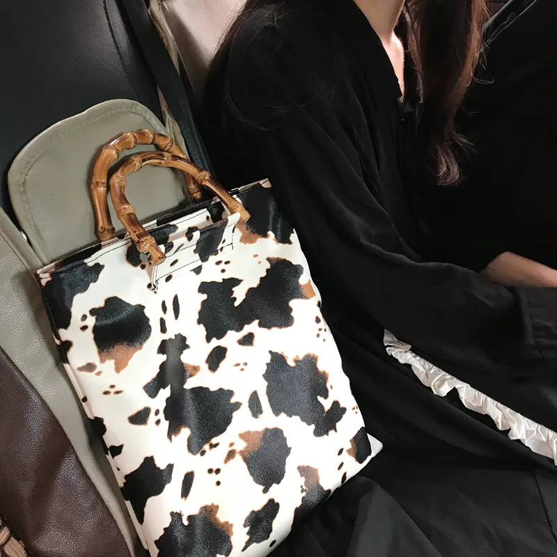 

Retro Cow Pattern Women Handbags Designer Bamboo Handle Hand Bags Casual Large Capacity Totes Female Purses lady Bucket Bag
