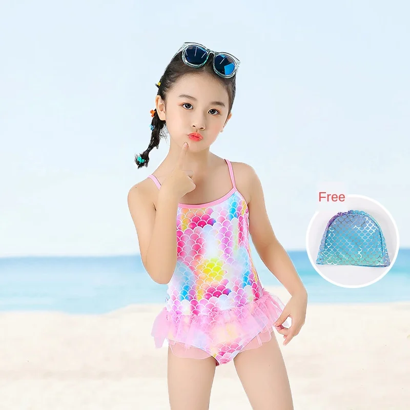 boy in girl's one piece swimsuit