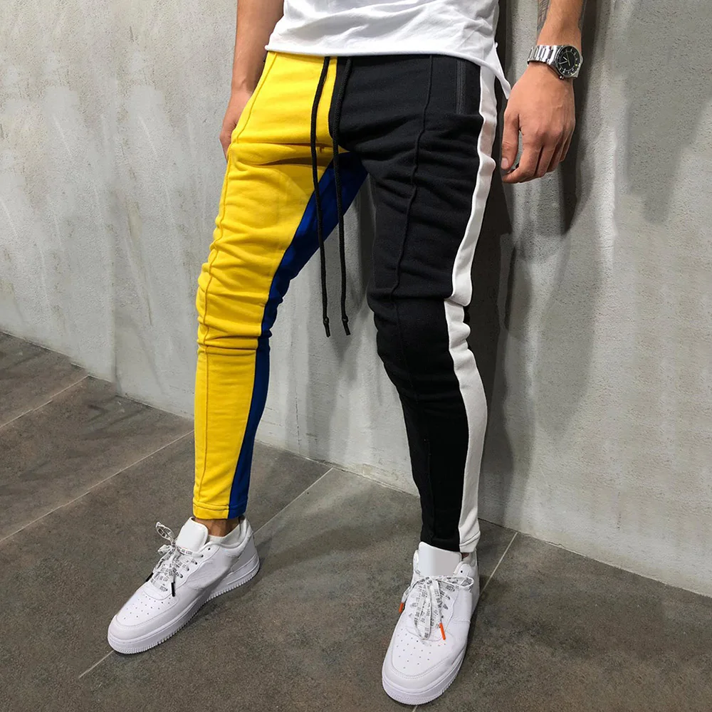Штаны спортивного цвета. Спортивные штаны слим фит джоггеры. Джоггеры колор блок. Мужские спортивные штаны 2020 модные. Жёлтые спортивные штаны мужские.