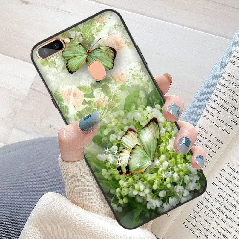 Red butterfly on white roses flower