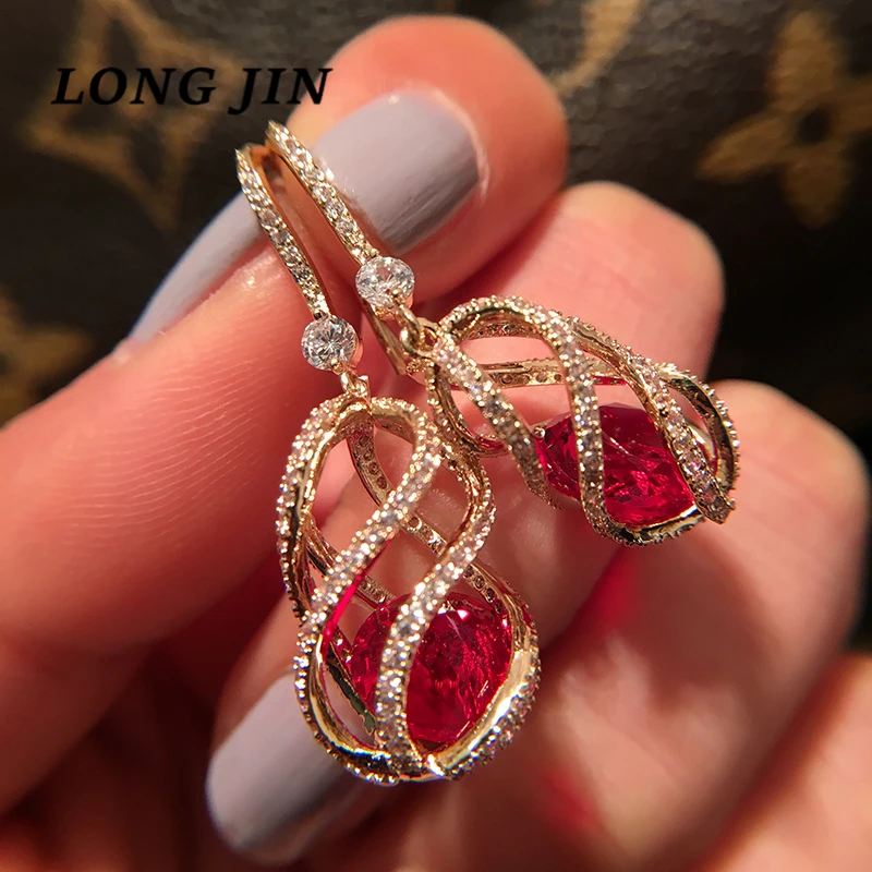 

Korean Version Of The Geometric Golden Hollow Flower Pendant Colored Zircon Earrings Women's Long Face Thin Pendant Earring