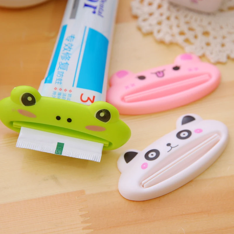 

1 Piece 9X4CM Colorful Cartoon Plastic Squeezer Toothpaste Dispenser Tool Home Bathroom Supplies Rolling Press Bracket Tool