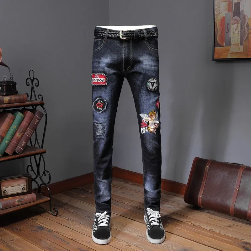 

Europe station Spring new youth men's personality printed badge patch patch stretch slim feet demin dark blue men jeans