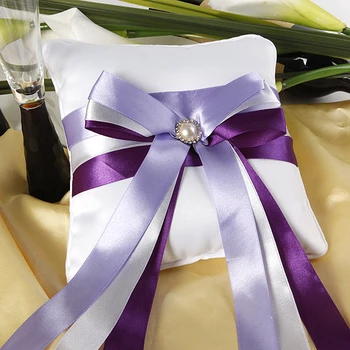 

White Ring Pillow With Purple Ribbons and Pearl