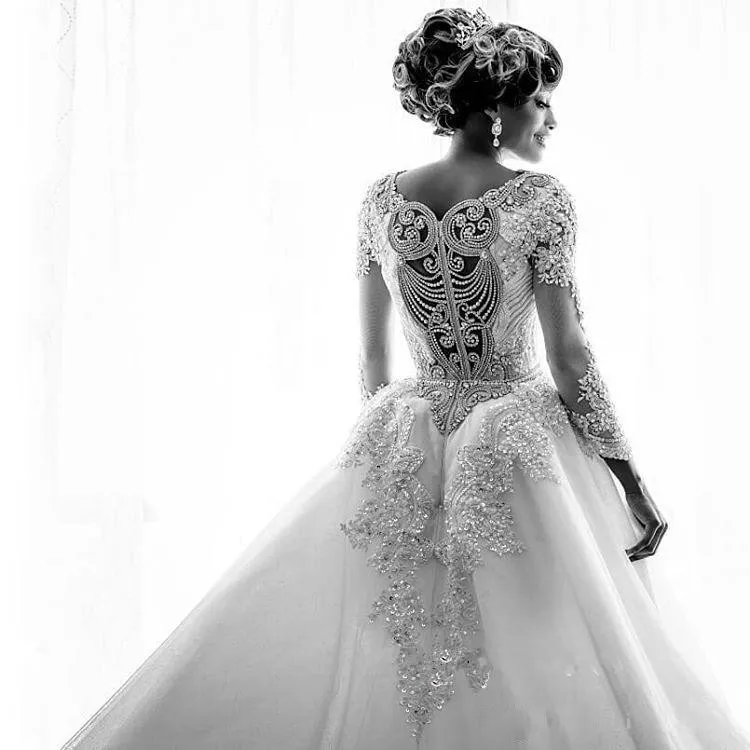2019 African Long Sleeves Lace Mermaid Wedding Dresses Scoop Neck Lace Applique Beaded Crystals Over Skirts Court Train Wedding Bridal Gown