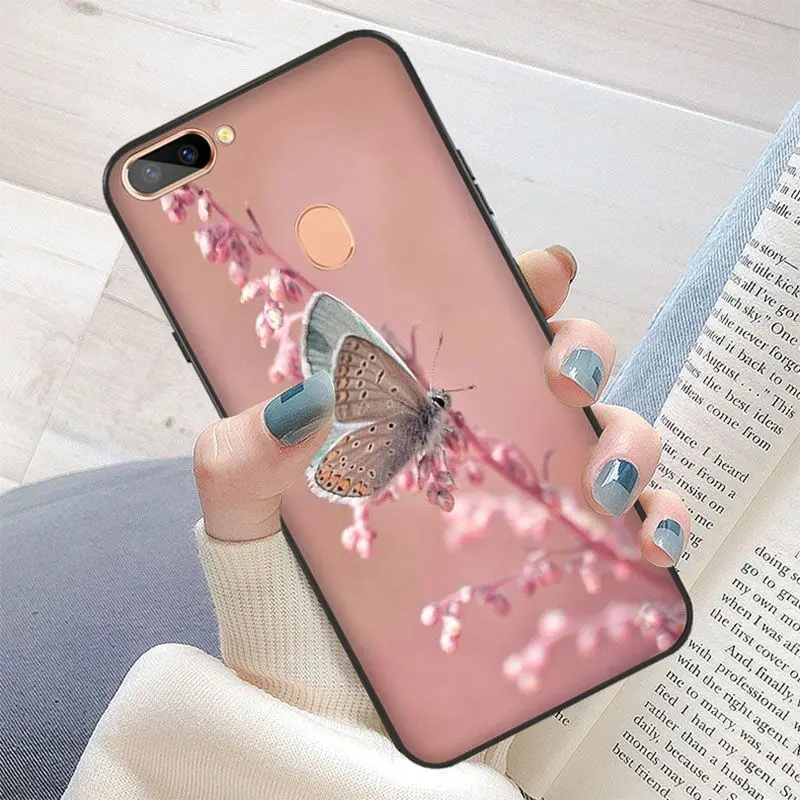 Red butterfly on white roses flower