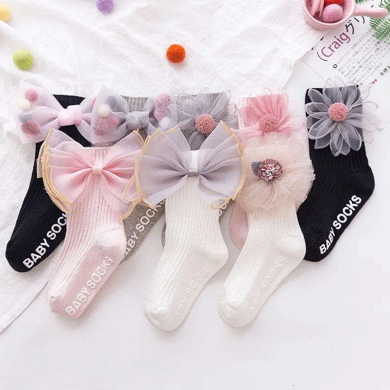 Новые детские носки с бантиками и цветами, гольфы для маленьких девочек хлопковые длинные носки для высоких ботинок для детей, носки принцессы для малышей