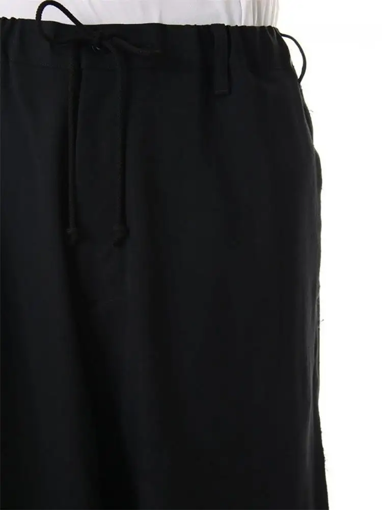Men's new casual wide-leg pants culottes irregular asymmetric button design of urban youth fashion black