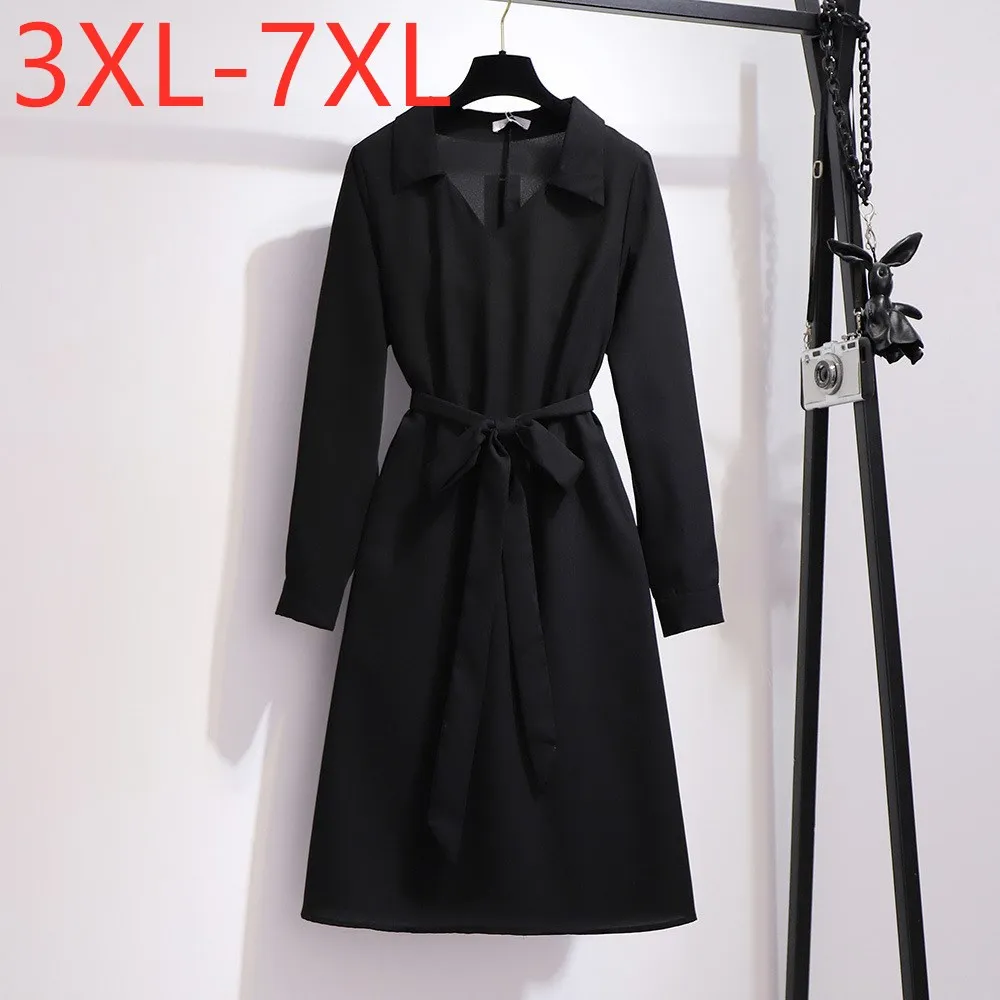 

Женское платье-рубашка средней длины, с длинным рукавом и поясом