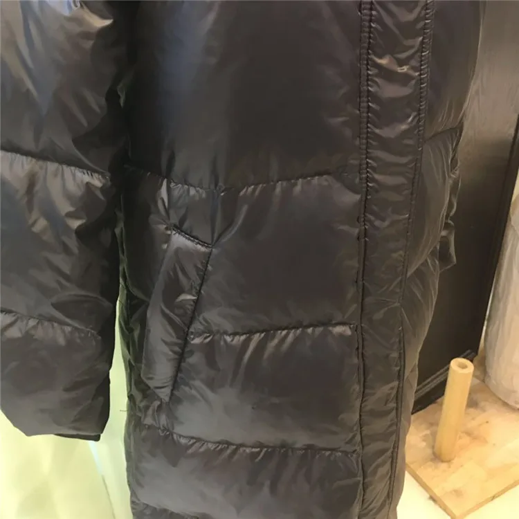 new Anti-season down jacket female long section over the knee thickening bright white duck down fashion Korean Slim