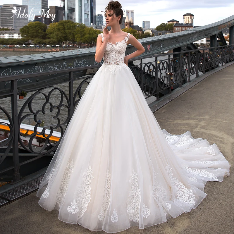 

Adoly Mey Romantic Scoop Neck Button A-Line Wedding Dresses 2020 Luxury Beaded Sashes Appliques Cap Sleeve Vintage Bridal Gown