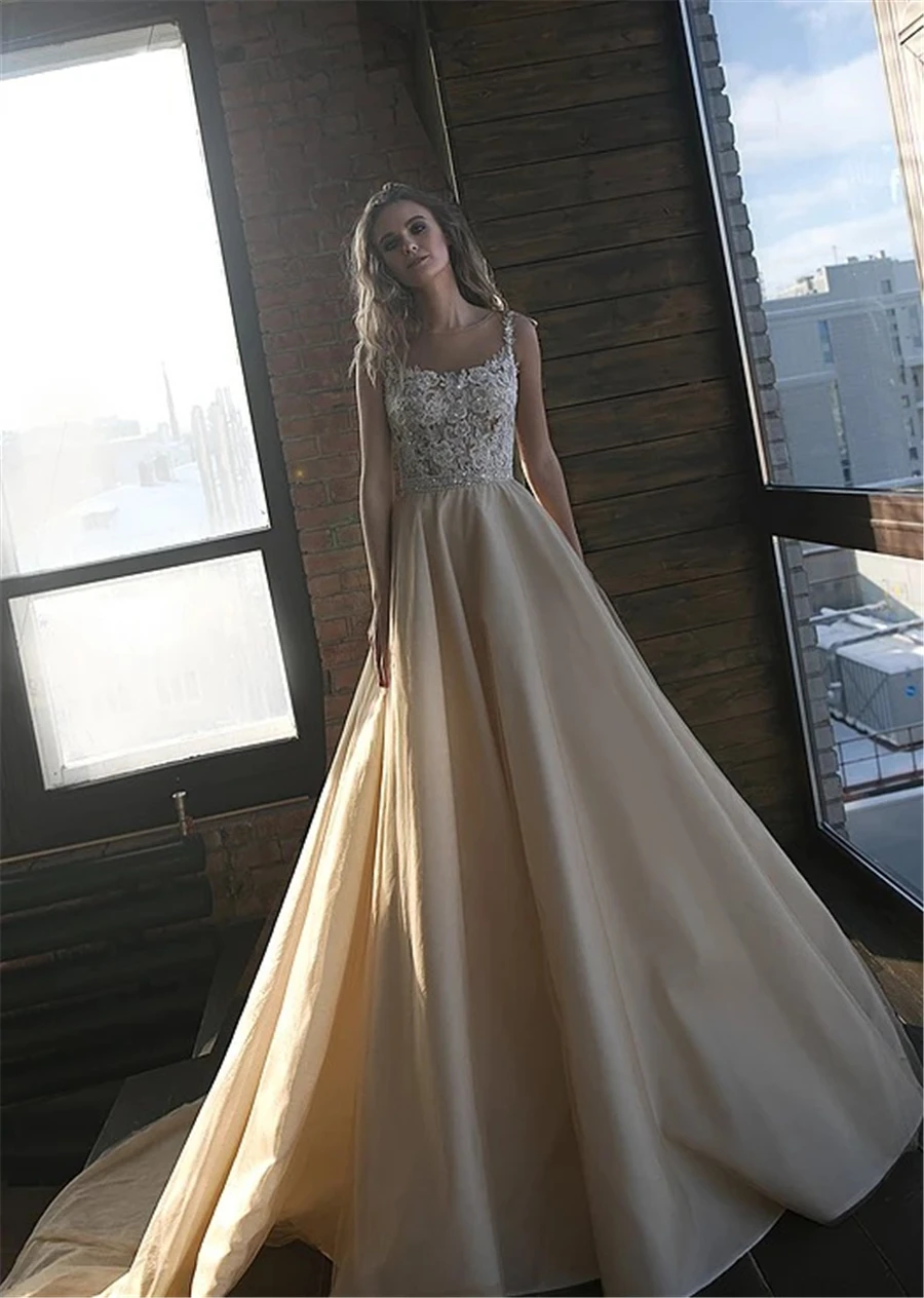 

Sheer Spaghetti Straps Champagne Wedding Dress Court Train Organza Bridal Dress vestidos novias boda