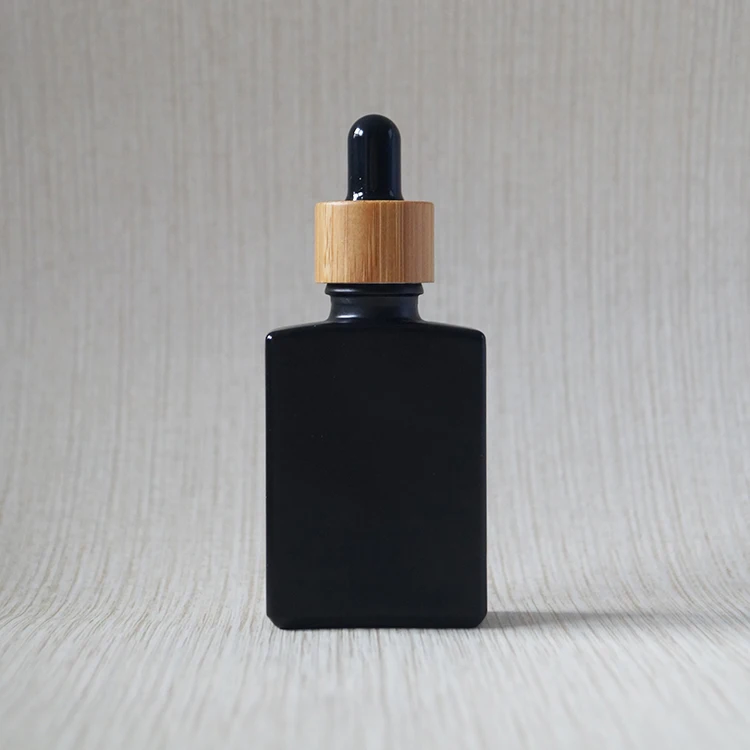 black matte Пользовательский гравировальный логотип Экологичная косметическая упаковка для ухода за кожей контейнер CBD стеклянная бутылка-капельница 30 мл с бамбуковой крышкой 1 унц - Цвет: black matte