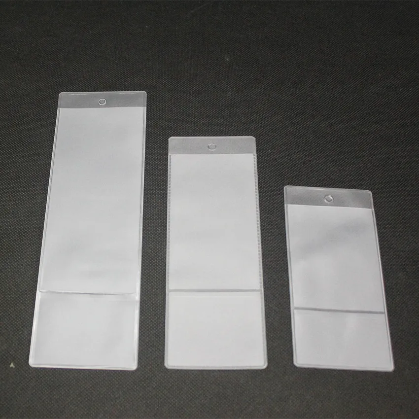 100pcs 작은 플라스틱 비닐 PVC 레이블 포켓 교수형 슬리브 보호 커버 가방 디스플레이 가격 기호 카드 태그 프로모션