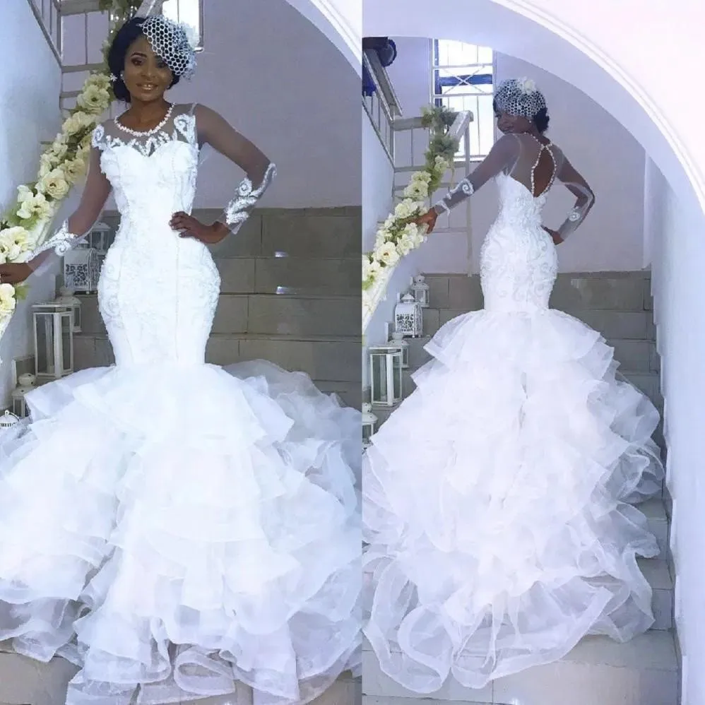 

2020 Sexy Sheer See Through African Wedding Dresses Long Sleeves Open Back Tiered Skirts Nigerian Bridal Wedding Gowns