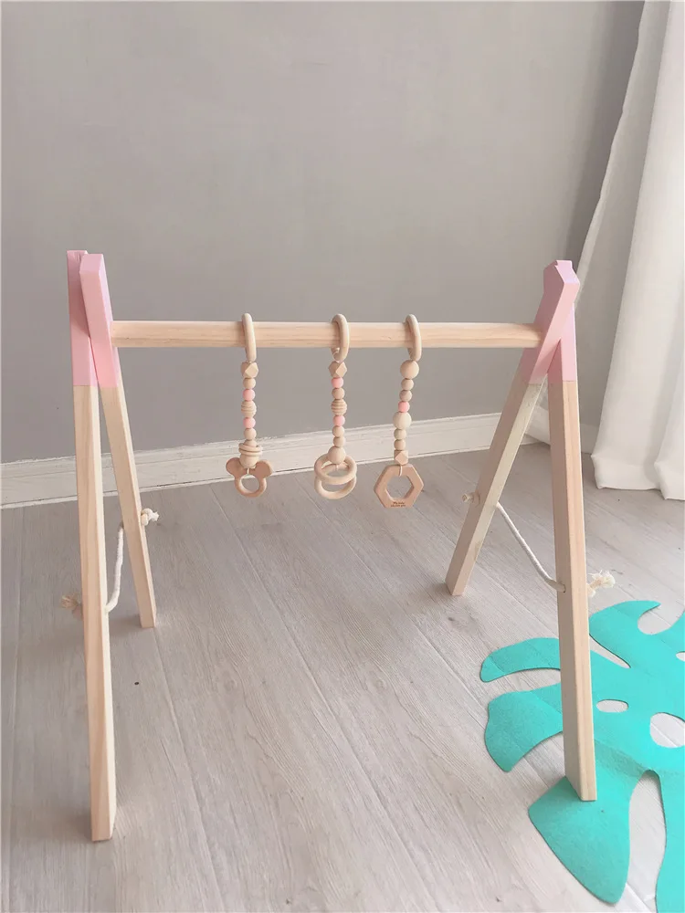 

Nordic Wooden Baby Gym with three Rattles Play Nursery Early Education Toy Wooden Activity Frame Kids Room Decor