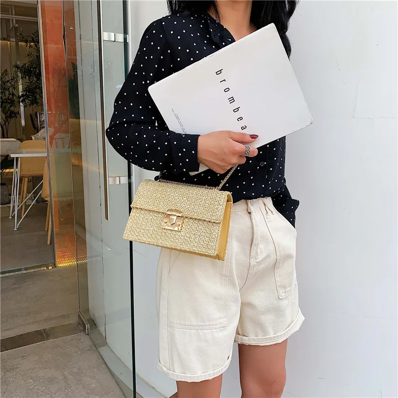 

2019 new Korean version of pig nose lock woven shoulder bag summer foreign style slung straw bag