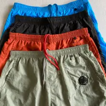 Pantalones cortos de nailon para hombre, shorts de verano para jóvenes, de alta calidad, para ocio al aire libre, pantalones holgados para la playa, pantalones de cinco puntos, 2021