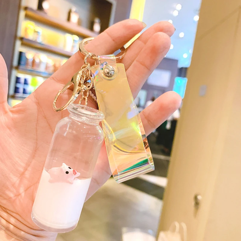 

Floating milk pig keychain chain quicksand drifting bottle into oil small golden pig bag pendant small gift