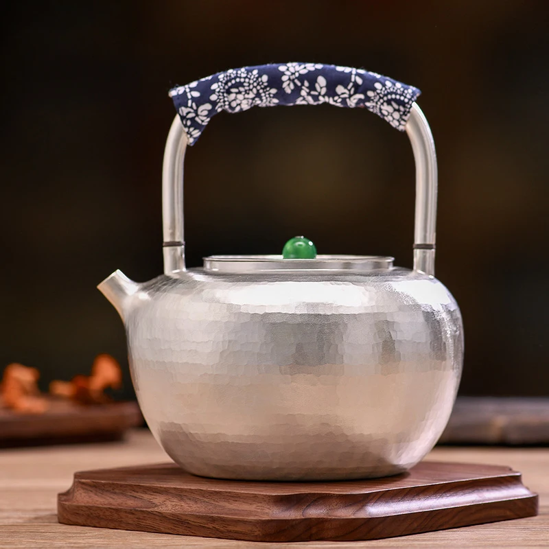 

Chinese style pure silver pot kettle home manual anti-scalding insulation hammer pattern large boiling water tea
