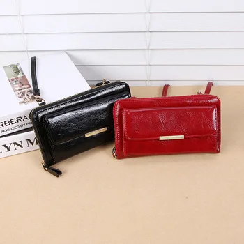 

Ladies diagonally holding a mobile phone bag in the long section of the Korean version of the personalized zipper bag