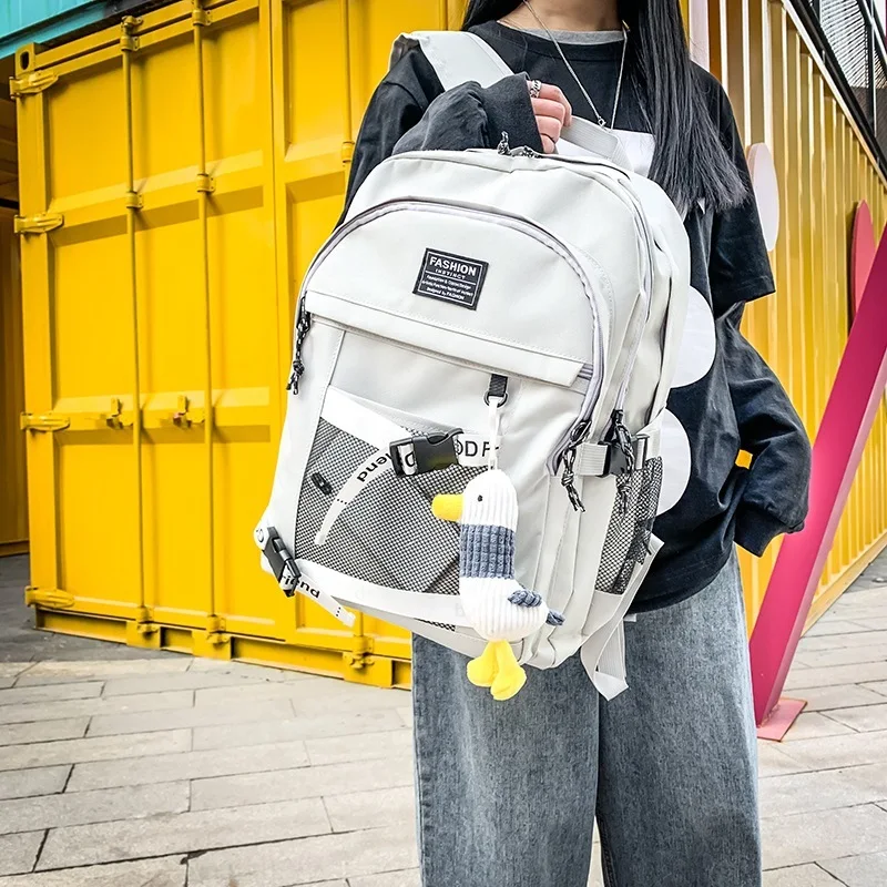 

The New Backpack Female Han Edition High School Male Students Bag Large Capacity of Cool Fashion Travel Leisure Bag