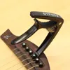 Guitarra eléctrica de aleación de Zinc negra, cejillas para acústicas, mandolina del ukelele, Banjo, 1 ud., 2 púas ► Foto 3/6