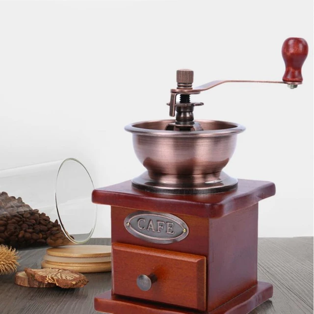 Vintage coffee grinder.Old retro hand-operated wooden and metal