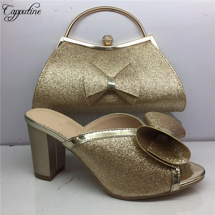 gold heels and clutch bag