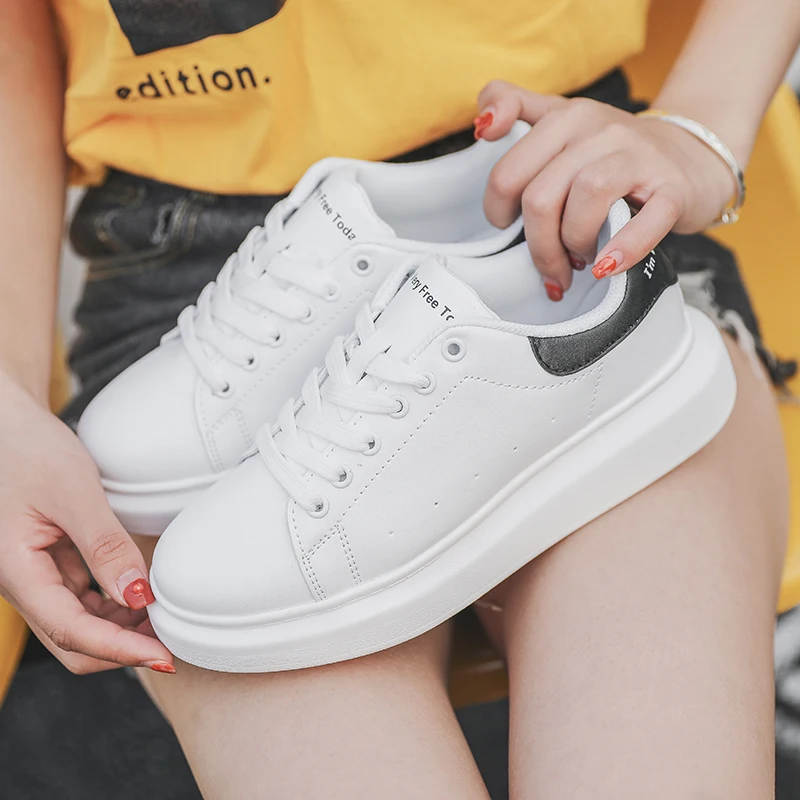 black leather sneakers white sole womens