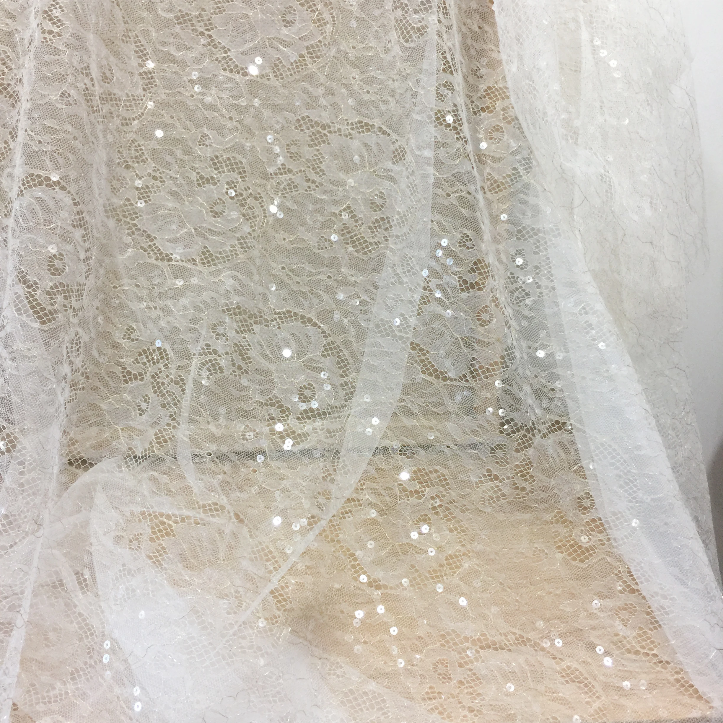 

Off white with Gold color wedding lace fabric with sequins shiny! 1 Meter long, 1.5 meters height high quality gowns lace nice!