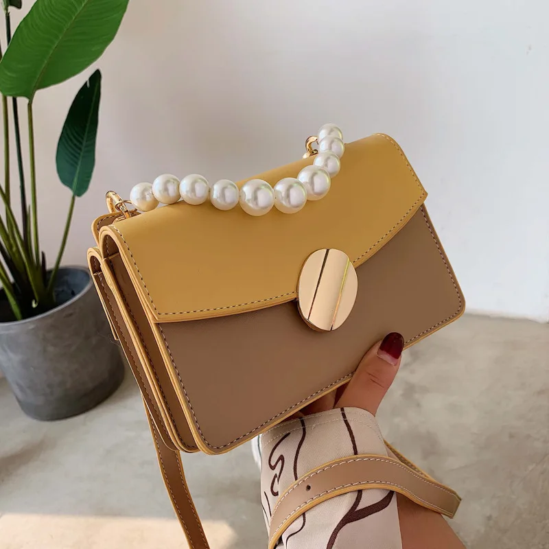 

Foreign gas woman 2019 new Korean version of texture pearl hand bag with one shoulder slant and two sides