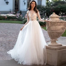 

Long Sleeve Wedding Dresses 2021 A-Line Tulle Bridal Gown For Women Lace Appliques Boat Neck Button Back Elegant Sweep Train
